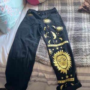 Never worn black jeans with sun and moon detail.